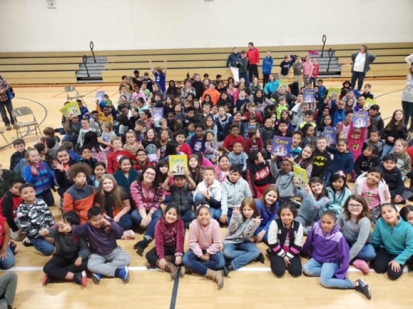 Shelli R. Johannes with students at a school visit